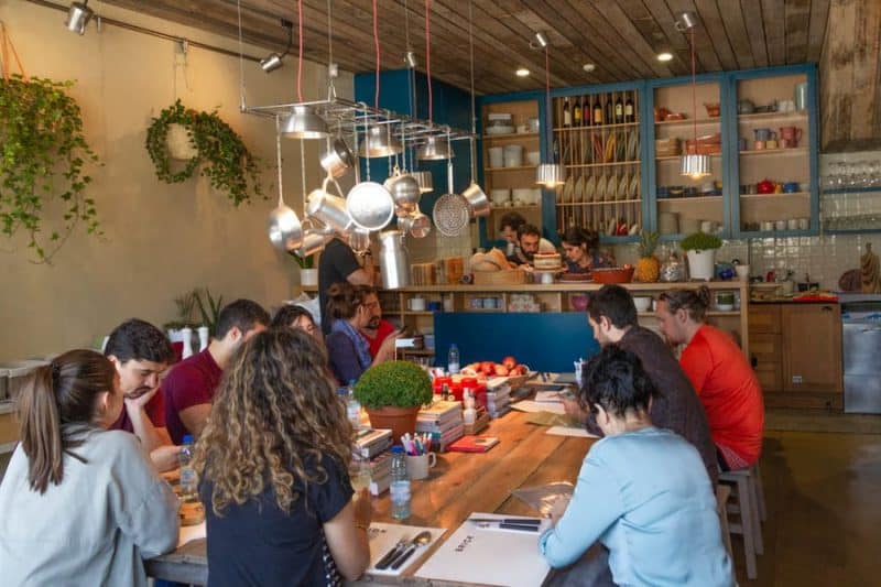 Diners sitting at a table inside the Brick restaurant